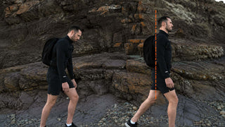 Man rucking with a black Ruckaway backpack showing upright, aligned posture versus slouched forward posture