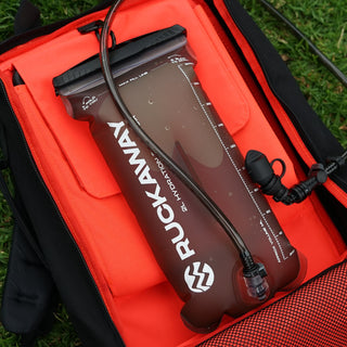 Rukavaya inflatable pump on a red background with grass visible