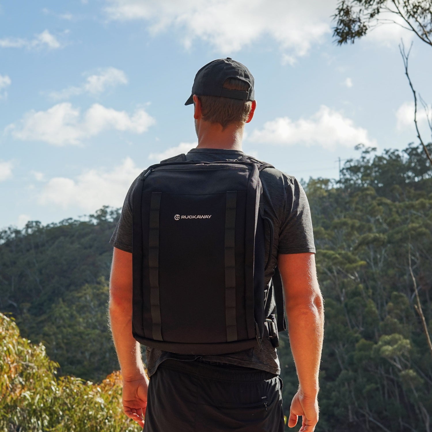 Man looking at view wearing Ruckaway weighted bag