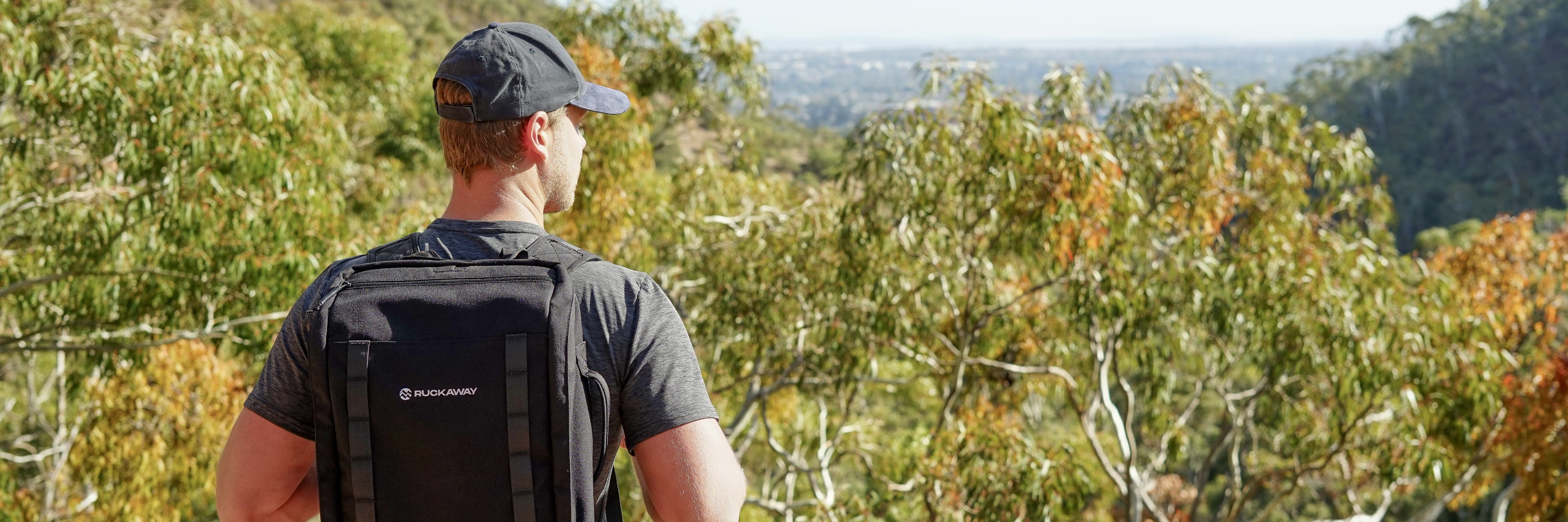 Man looking at view wearing Ruckaway rucking pack