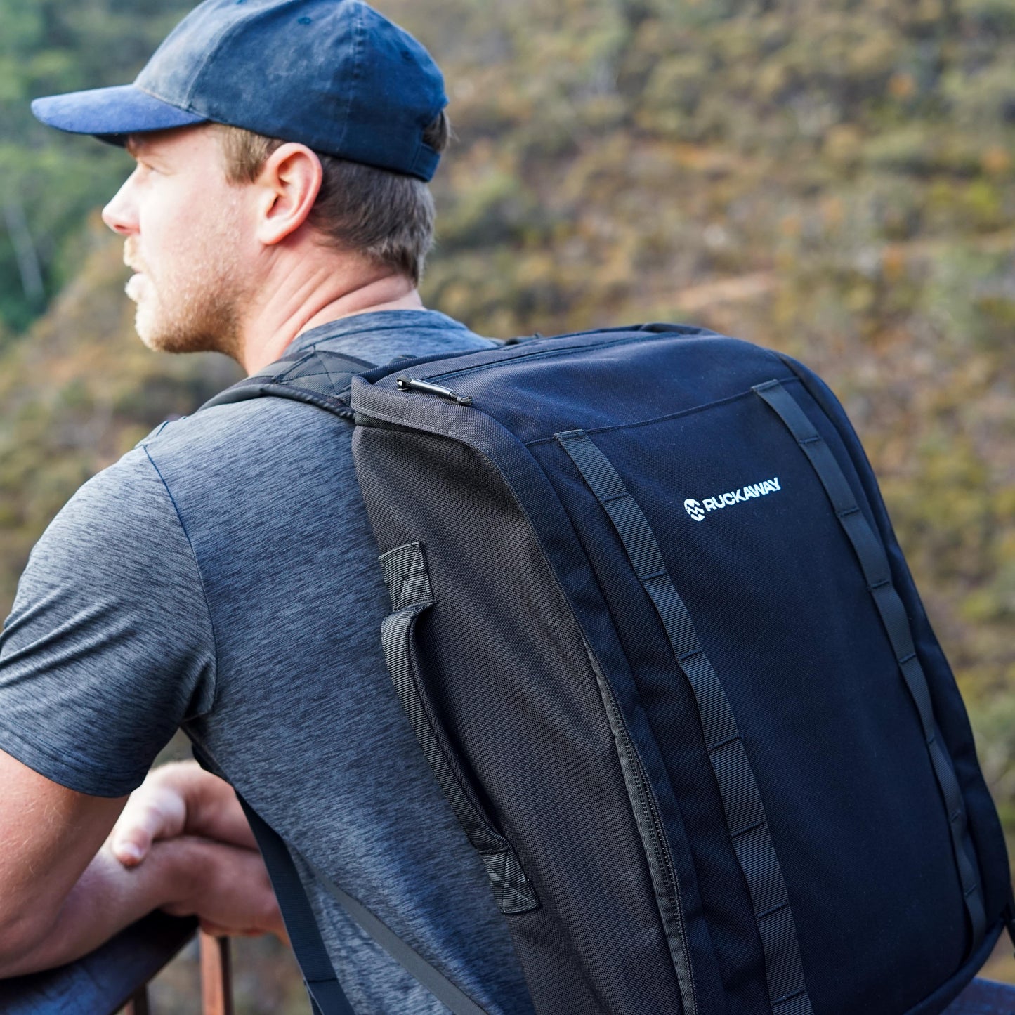 Man wearing Ruckaway rucking pack looking at view